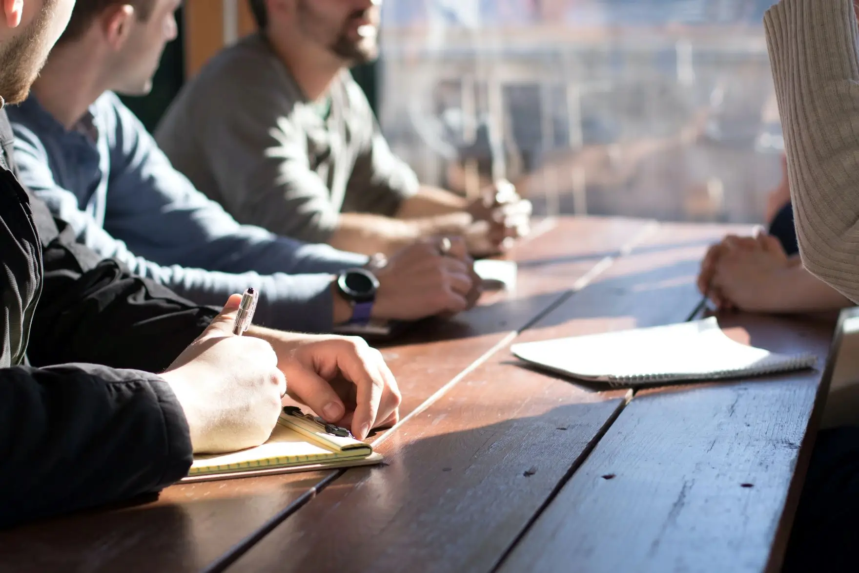 people conducting user interviews at desk